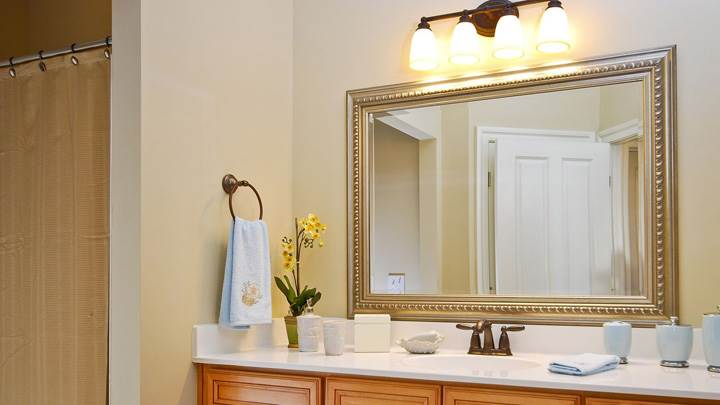 Big Mirror With Golden Frame In Bathroom